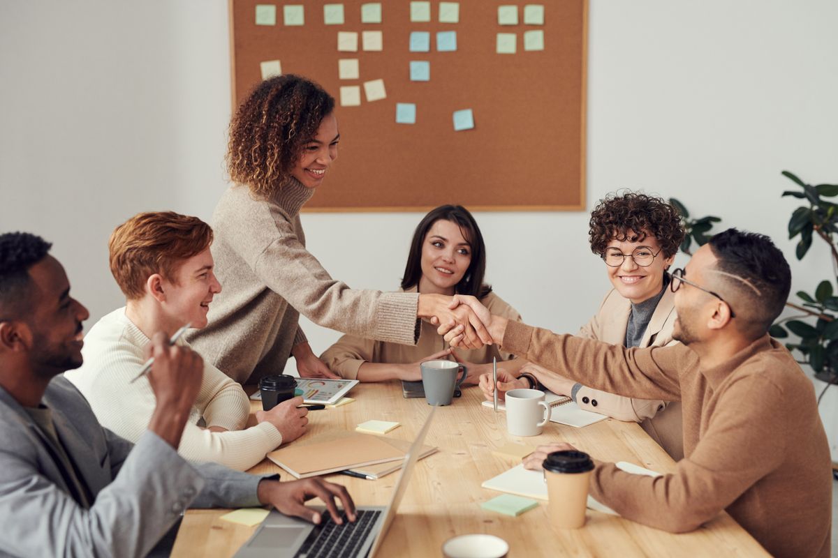 Black business professional collaborating with a consulting team during a business analysis session